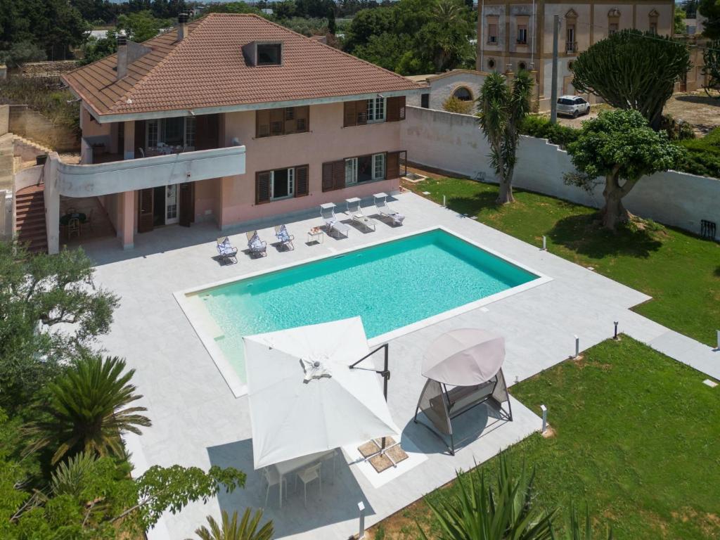 an aerial view of a house with a swimming pool at Holiday Home Sammartano by Interhome in Marsala