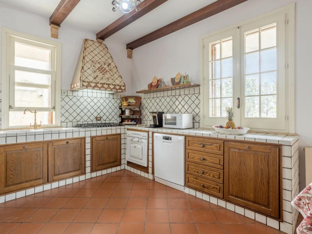 A kitchen or kitchenette at Holiday Home Sammartano by Interhome