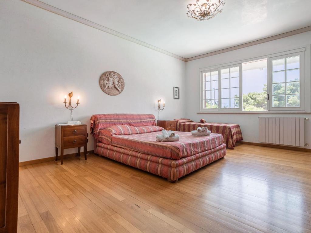 A bed or beds in a room at Holiday Home Sammartano by Interhome