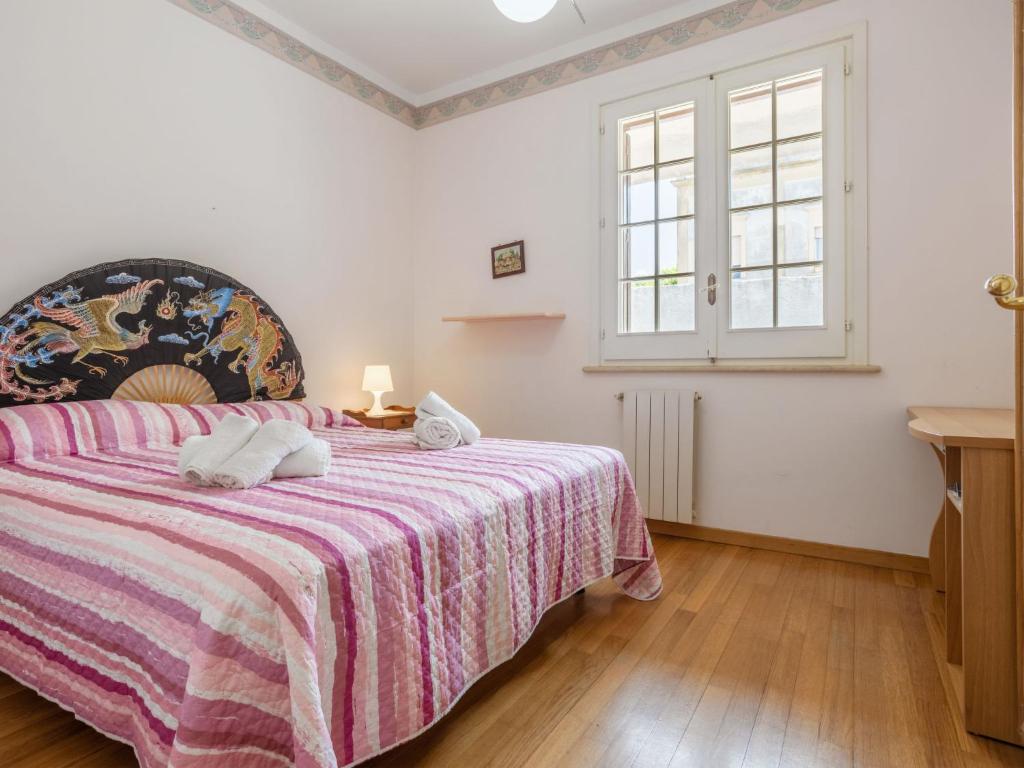 A bed or beds in a room at Holiday Home Sammartano by Interhome