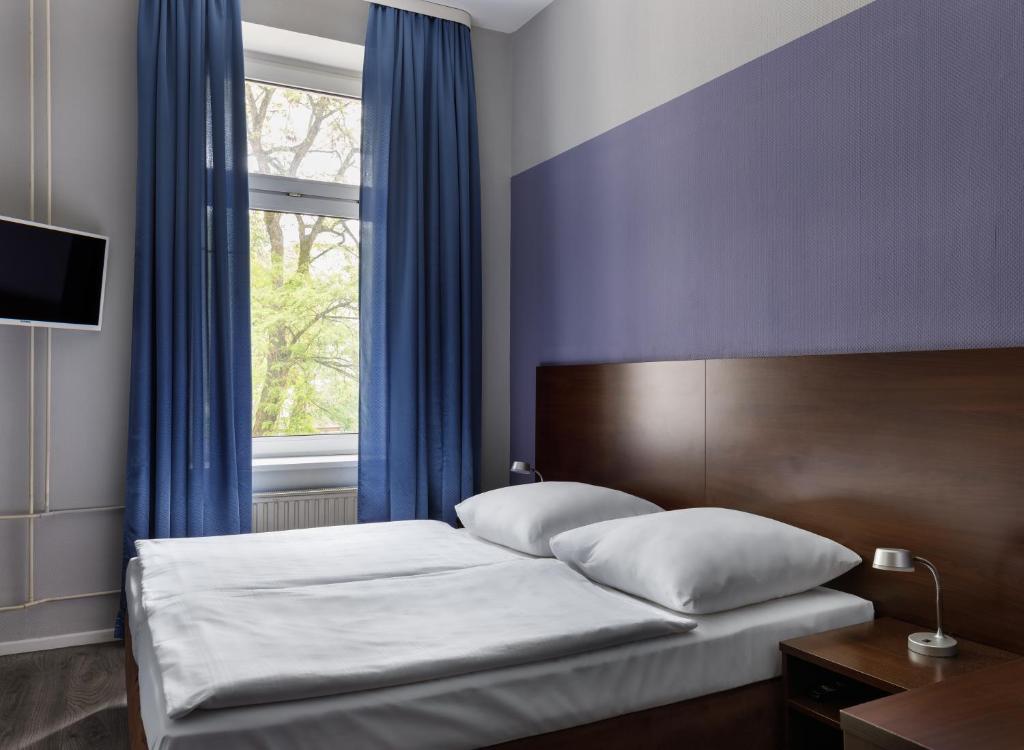 Postel nebo postele na pokoji v ubytování Hotel Nova