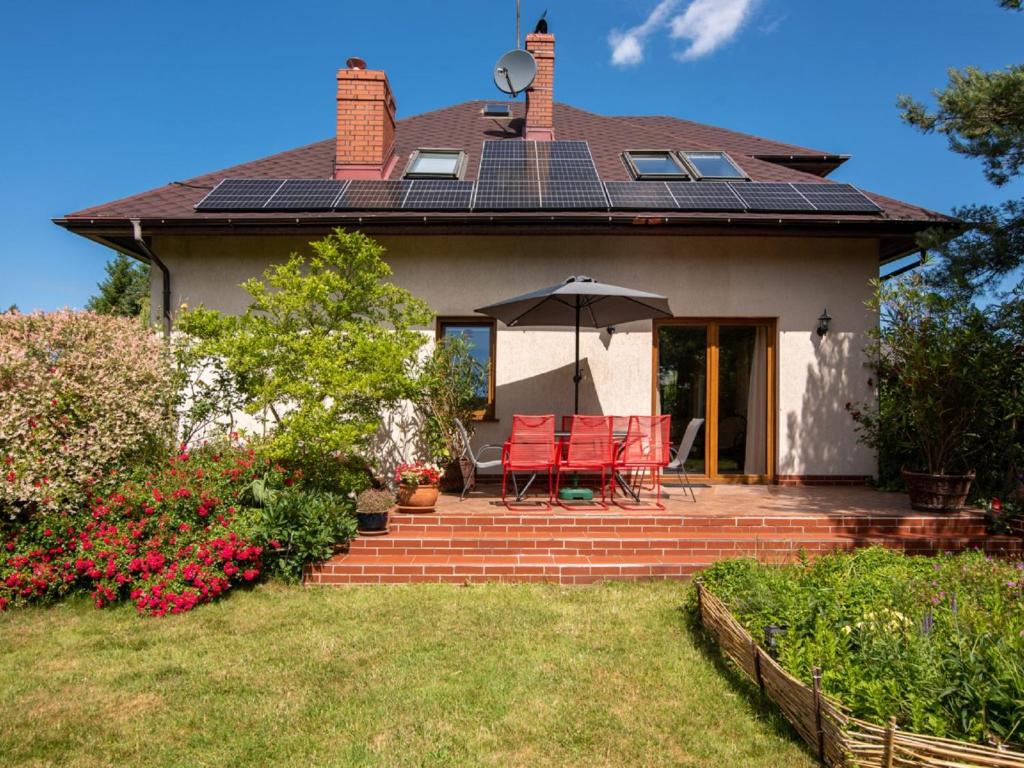 a house with solar panels on the roof at Holiday Home Sianożęty by Interhome in Sianozety