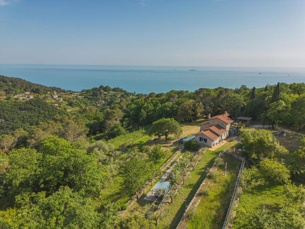 an aerial view of a house with the ocean in the background at Holiday Home Casa Marepietra by Interhome in Ameglia