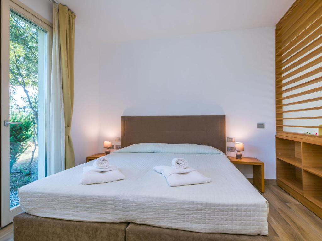 Posteľ alebo postele v izbe v ubytovaní Holiday Home Biovillage-6 by Interhome