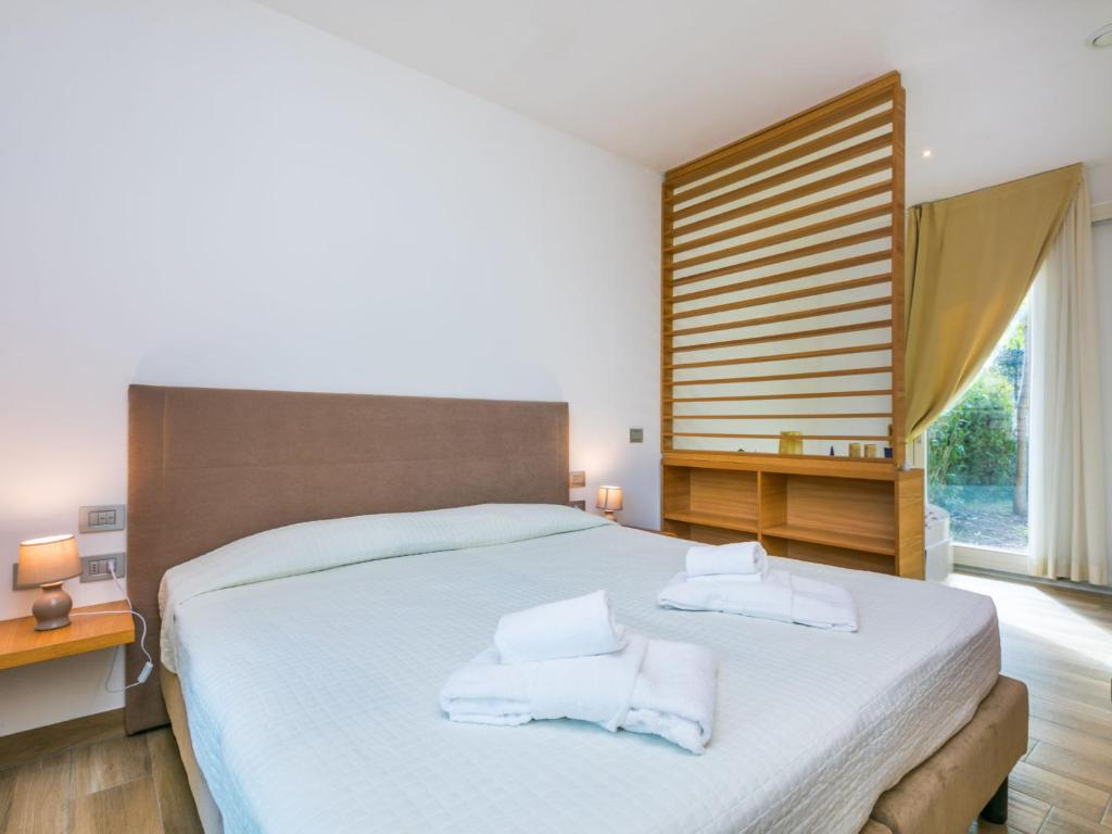 Posteľ alebo postele v izbe v ubytovaní Holiday Home Biovillage-6 by Interhome