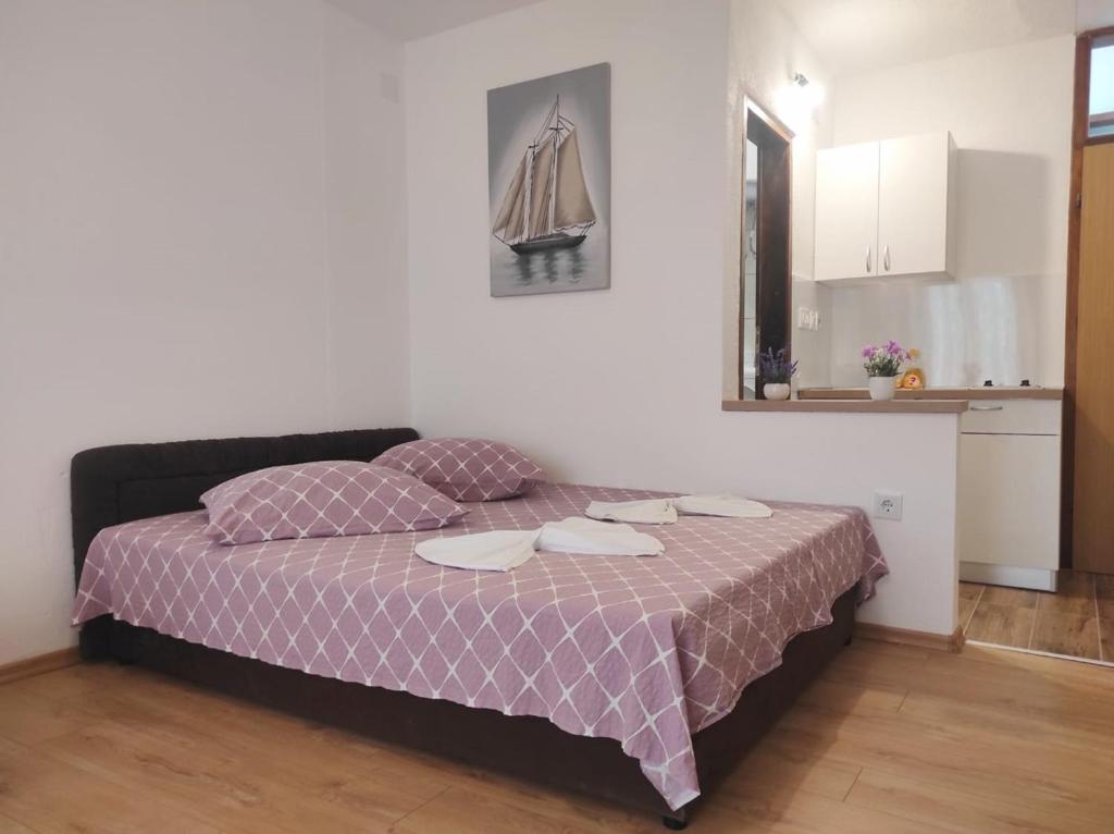 Postel nebo postele na pokoji v ubytování Apartments Kata