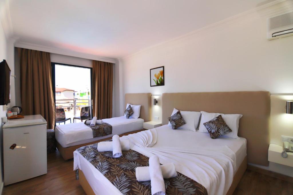 Postel nebo postele na pokoji v ubytování Bahar Hotels
