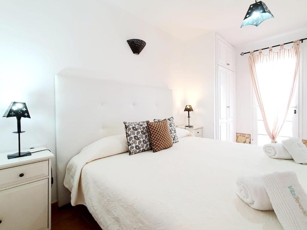 A bed or beds in a room at Casa Piscis
