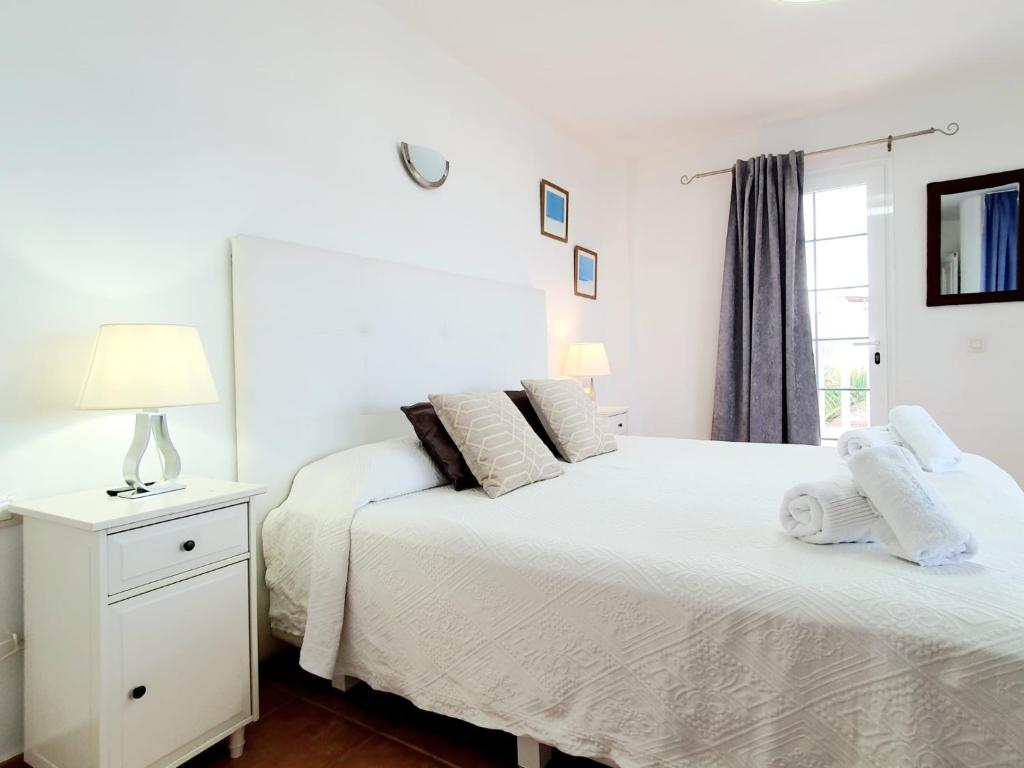 A bed or beds in a room at Casa Piscis