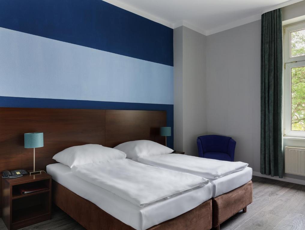 Postel nebo postele na pokoji v ubytování Hotel Nova
