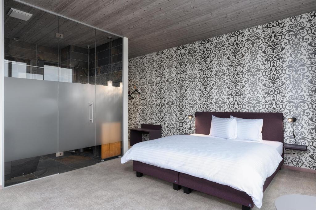 Postel nebo postele na pokoji v ubytování b-smart hotel Menziken