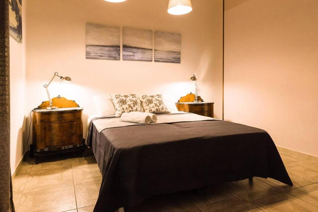 Postel nebo postele na pokoji v ubytování Al Palazzetto di Milo