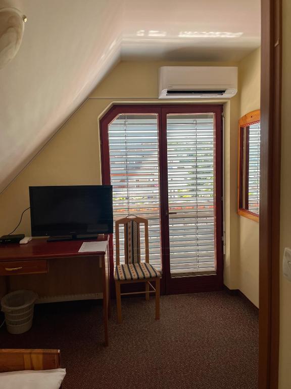 TV a/nebo společenská místnost v ubytování Guesthouse Jurcek