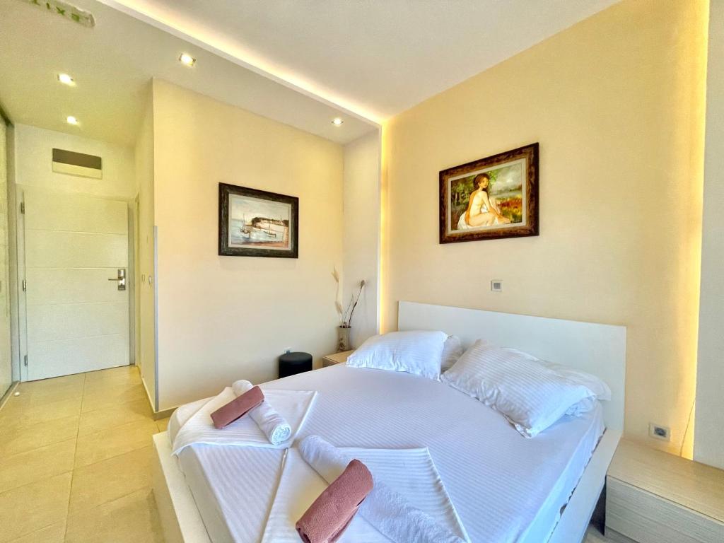 Voodi või voodid majutusasutuse Hotel Butua Residence toas