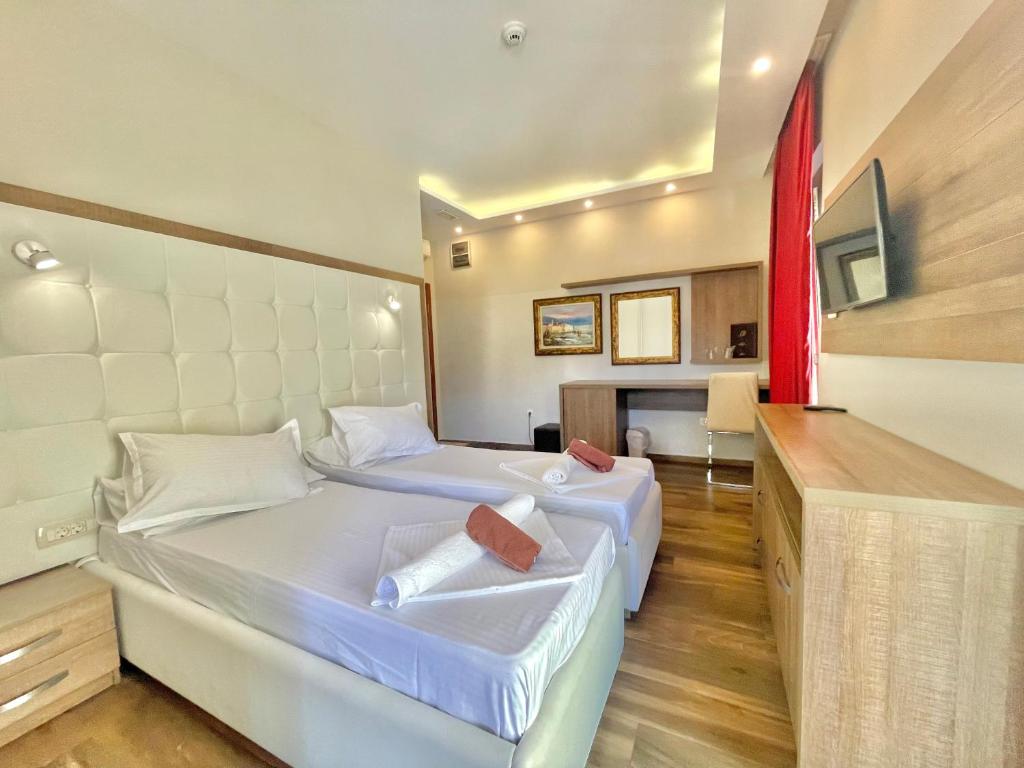 Voodi või voodid majutusasutuse Hotel Butua Residence toas