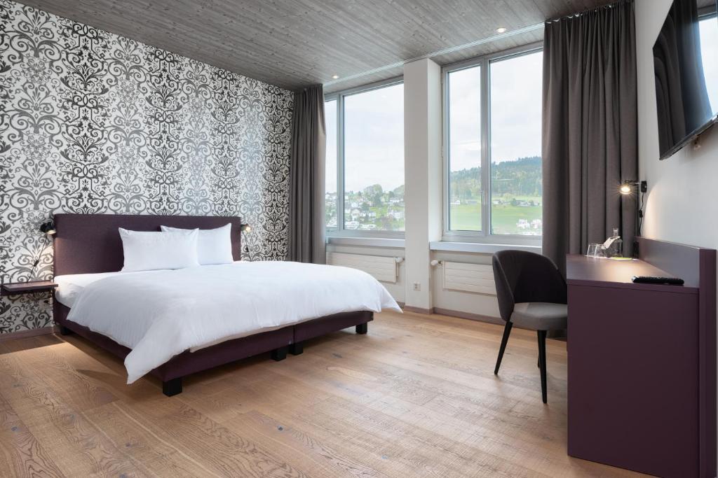 Postel nebo postele na pokoji v ubytování b-smart hotel Menziken