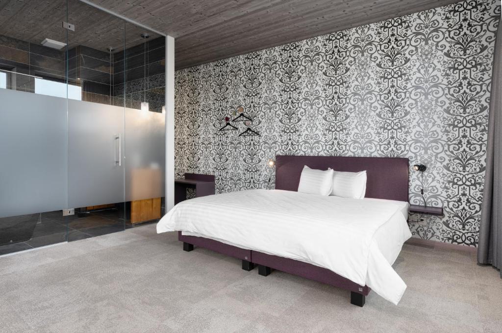 Postel nebo postele na pokoji v ubytování b-smart hotel Menziken