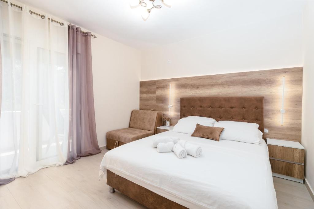 Postel nebo postele na pokoji v ubytování Apartments Ada Bojana