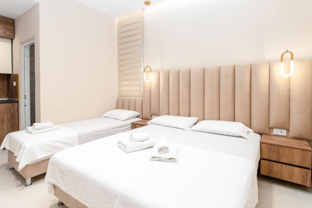 Postel nebo postele na pokoji v ubytování Apartments Ada Bojana