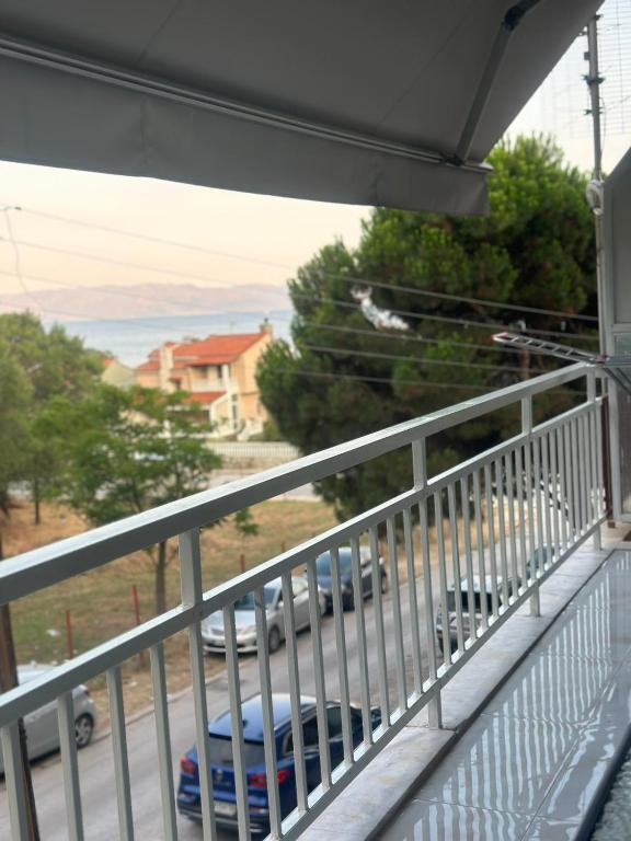 a balcony with a view of a parking lot at Greek Escape in Paleo Tsifliki