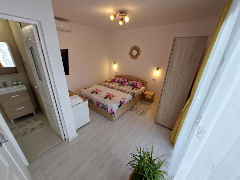 Postel nebo postele na pokoji v ubytování Casa AnaMaria