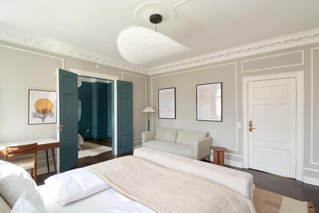 Postel nebo postele na pokoji v ubytování Stylish 4 Bedroom Apartment in CPH City