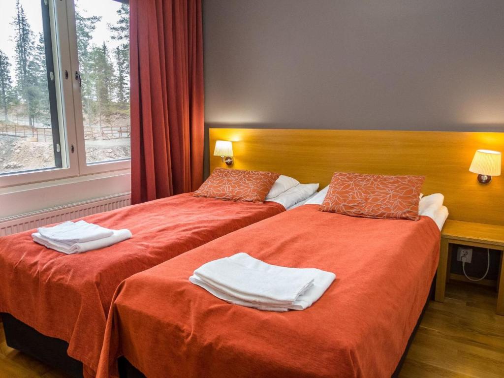 Postel nebo postele na pokoji v ubytování Holiday Home Ruka ski chalets 46- 1207 by Interhome