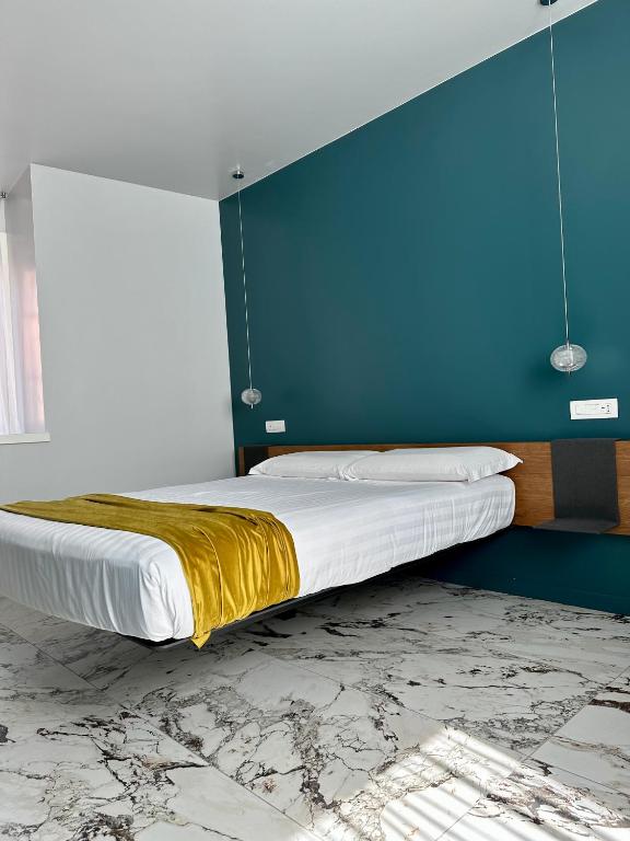 Postel nebo postele na pokoji v ubytování Vulcano Palace