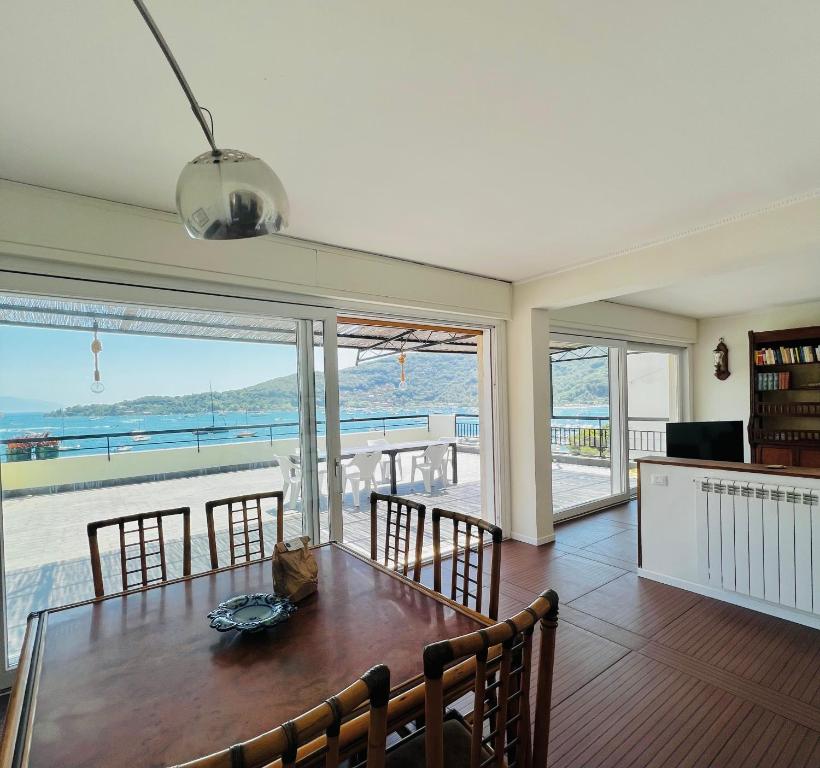 a dining room with a table and a view of the ocean at La Grande Terrazza in Portovenere