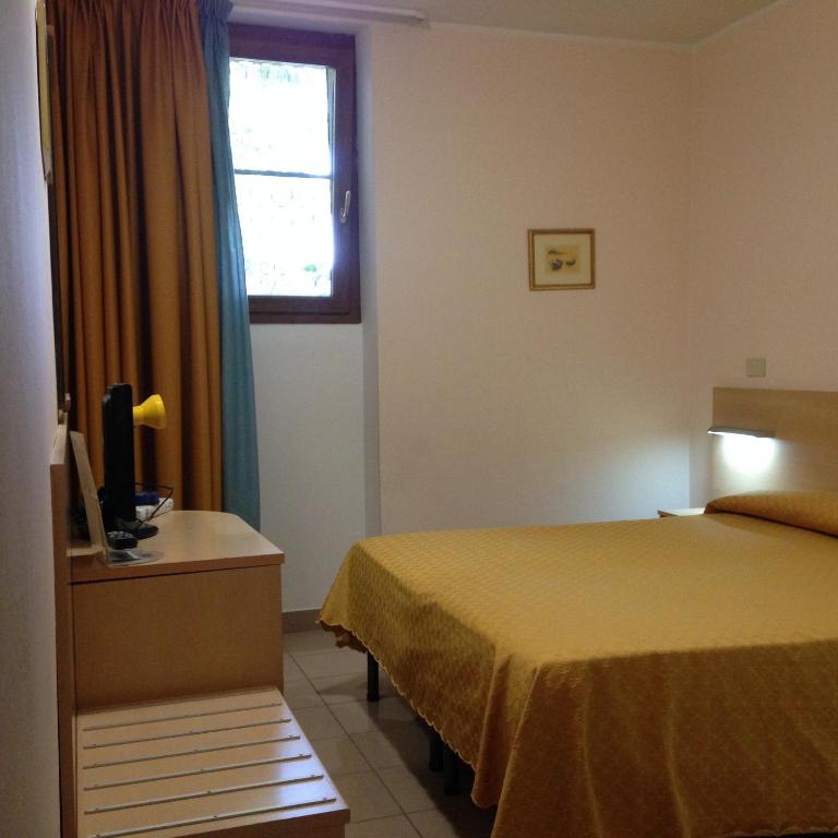 Postel nebo postele na pokoji v ubytování Hotel Johnson