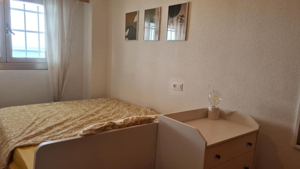 Posteľ alebo postele v izbe v ubytovaní Apartmán pri mori