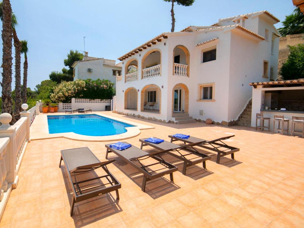 a villa with a swimming pool and a house at Villa Pax et Lucis by Interhome in Benissa