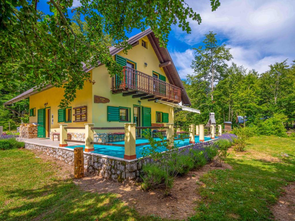 a house with a swimming pool in front of it at Holiday Home Legendao 2 by Interhome in Lukovo