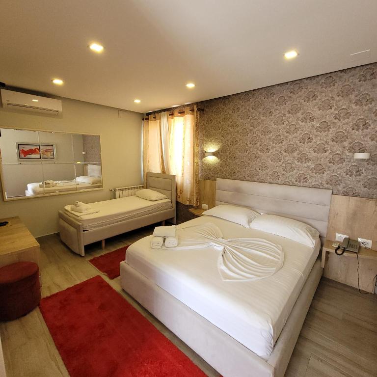 Postel nebo postele na pokoji v ubytování Hotel Erandi