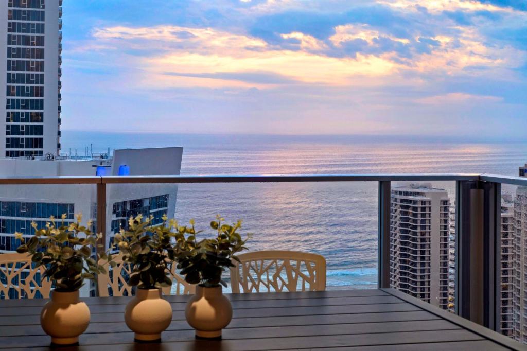 a balcony with a view of the ocean from a building at Ocean View Apartments - Self Contained & Privately Managed in Gold Coast