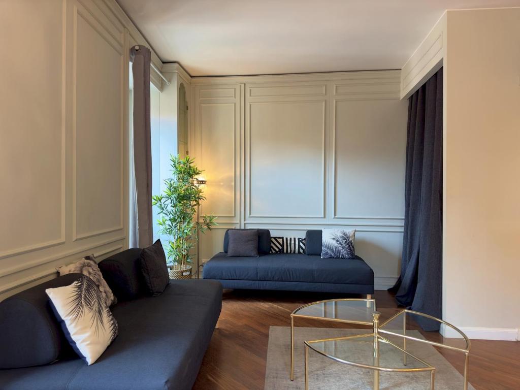 a living room with a couch and a table at Appartme Stampa 1 in Milan