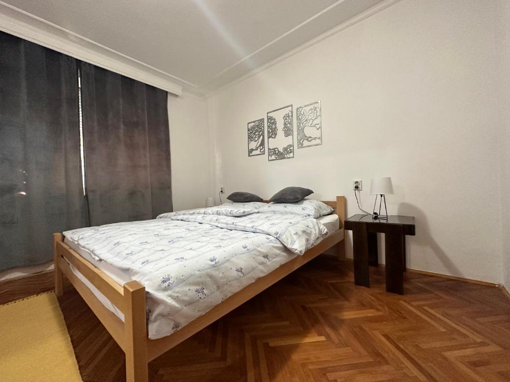 Postel nebo postele na pokoji v ubytování Centar Apartman