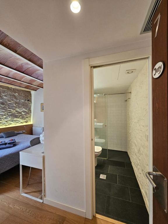 Postel nebo postele na pokoji v ubytování Hotel Can Bo De Pau