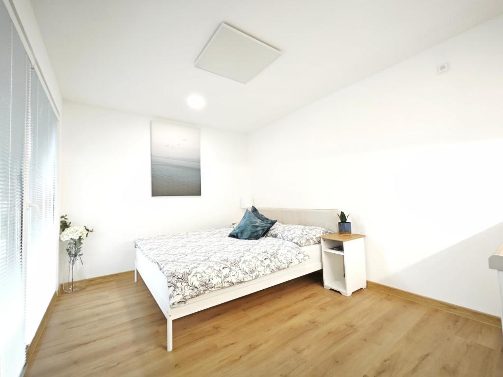Postel nebo postele na pokoji v ubytování Apartmány Relax