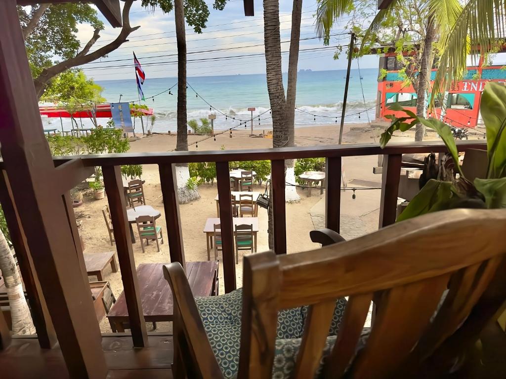 a view of the beach from the balcony of a resort at Rustic Beach Front Hotel Brasilito in Brasilito