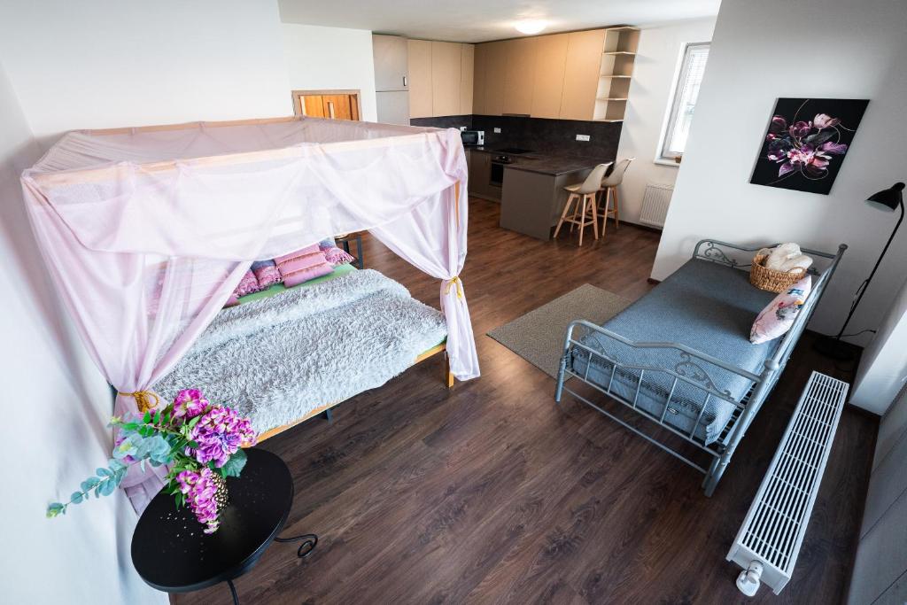Postel nebo postele na pokoji v ubytování GLAM apartmán Bučovice