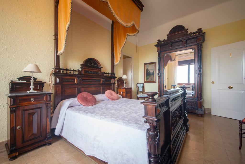Posteľ alebo postele v izbe v ubytovaní Habitaciones Villa Marcia Solo Adulto