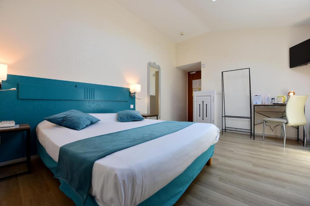 Postel nebo postele na pokoji v ubytování Hôtel du Parc