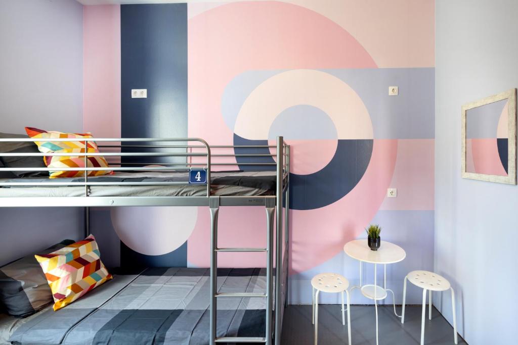 Postel nebo postele na pokoji v ubytování Bla Bla Hostel