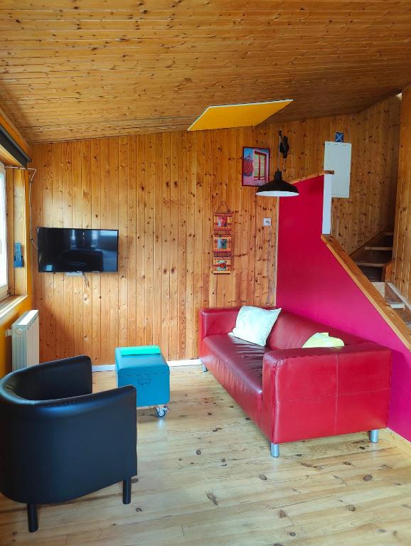 Televízia a/alebo spoločenská miestnosť v ubytovaní Chalet Ailleurs Appartement à Molines en Queyras