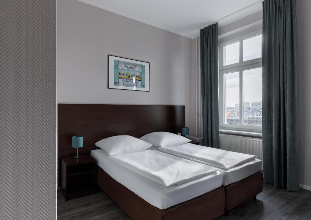 Postel nebo postele na pokoji v ubytování Hotel Nova
