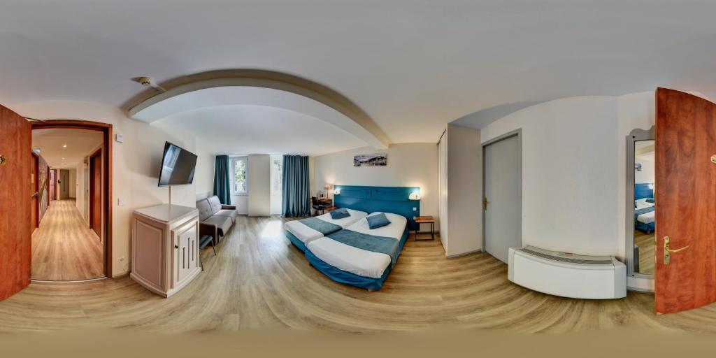Postel nebo postele na pokoji v ubytování Hôtel du Parc