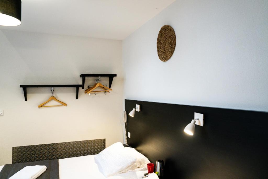 Letto o letti in una camera di Hôtel Le Loft