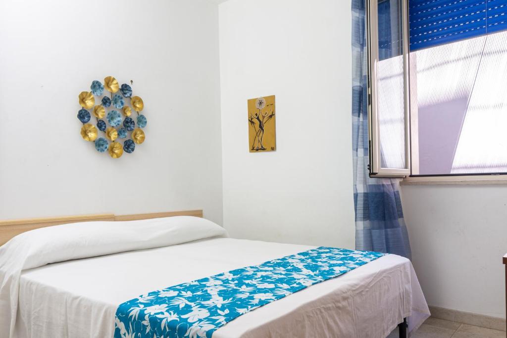 Postel nebo postele na pokoji v ubytování Acquamarina di Mancaversa