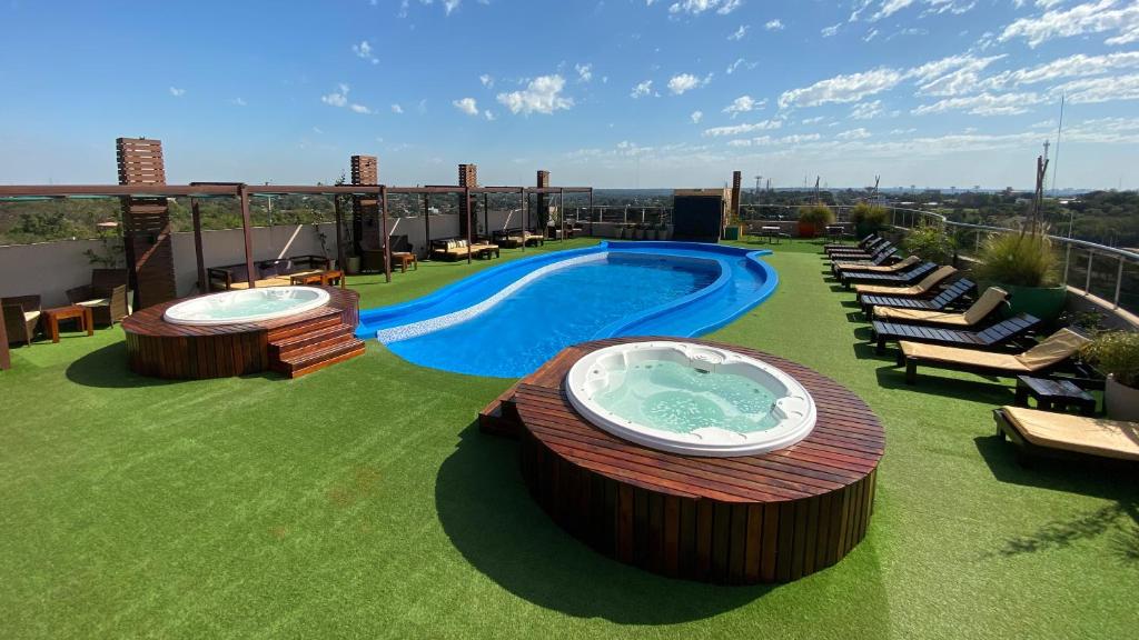 a swimming pool on the roof of a building at Grand Crucero Hotel in Puerto Iguazú